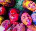 Photo of faces covered in paint at festival
