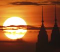 The Petronas Towers silhouetted by the sunset