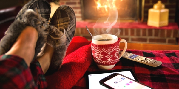 Slippers with mug by fire