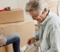 Mature couple pack their home