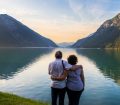 older couple looking at lake achen in austria
