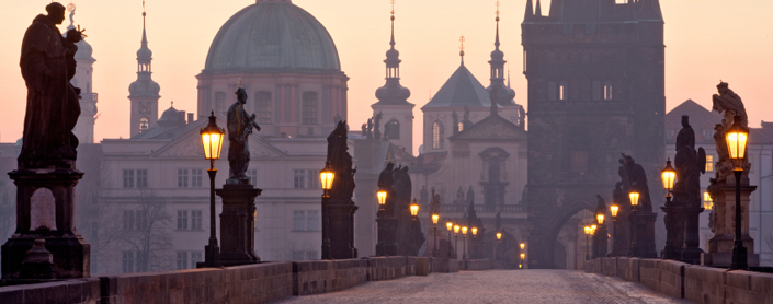 A view of Charles Bridge in Prague, at dusk