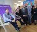 Staysure Travel Staff on a giant deckchair at the launch of the new Coventry office