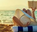 Woman reading on beach