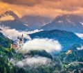 Wide-view of magnificent Neuschwanstein Castle in mountains