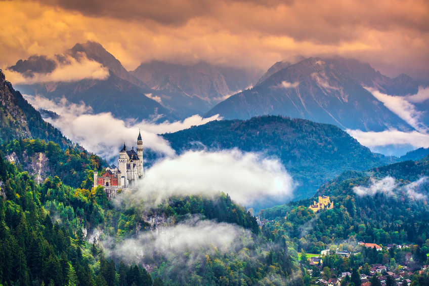 Wide-view of magnificent Neuschwanstein Castle in mountains