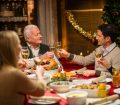 Family enjoying roast lunch
