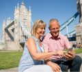 Couple using London travel app