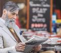 Man reading newspaper