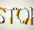 cigarettes arranged in letters to spell stop