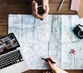 Map with Laptop and Travel Accessories
