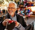 Couple drinking hot drinks at Christmas Market