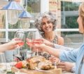 Over 50s eating healthy over dinner table