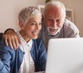 mature couple on computer online shopping