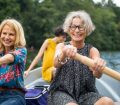 female friends rowing on holiday