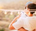 couple dancing outdoors under lights