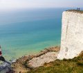 an image of a lighthouse just off the white cliffs of Dover