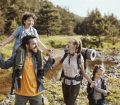 Family hiking through woods