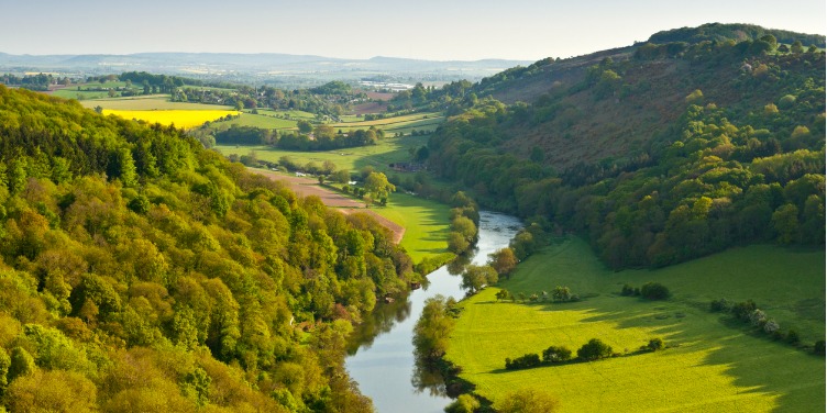 an image of a river running through rural England