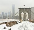 Brooklyn Bridge covered in snow during winter