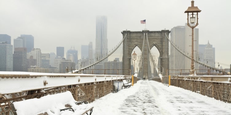 Brooklyn Bridge covered in snow during winter