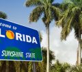 Welcome to Florida sign with palm trees